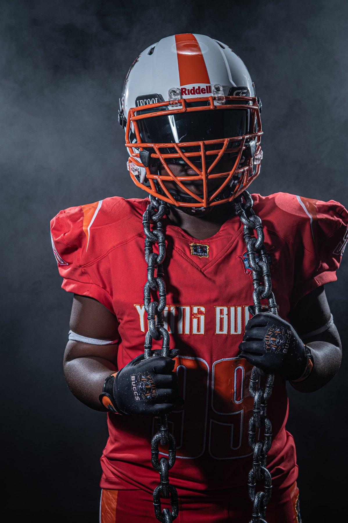 Dramatically lit football portrait from Mike N Ike Studios